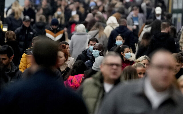 Shoppers walk along Oxford Street, Europe's busiest shopping street, in London, Dec. 18, 2021 (AP Photo/Frank Augstein) Shoppers walk along Oxford Street, Europe's busiest shopping street, in London, Dec. 18, 2021 (AP Photo/Frank Augstein)
