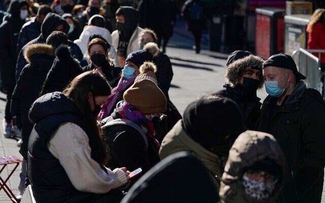 People wait in a long line to get tested for COVID-19 in Times Square, New York, Dec. 20, 2021. (Seth Wenig/AP) People wait in a long line to get tested for COVID-19 in Times Square, New York, Dec. 20, 2021. (Seth Wenig/AP)