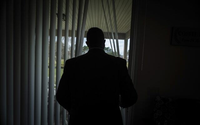 Joseph Moore looks out of a window at his home in Jacksonville, Florida, on Tuesday, Dec. 7, 2021 (AP Photo/Robert Bumsted) Joseph Moore looks out of a window at his home in Jacksonville, Florida, on Tuesday, Dec. 7, 2021 (AP Photo/Robert Bumsted)