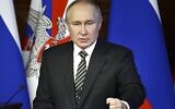 Russian President Vladimir Putin addresses an extended meeting of the Russian Defense Ministry Board at the National Defense Control Center in Moscow, Russia, on December 21, 2021. (Mikhail Tereshchenko, Sputnik, Kremlin Pool Photo via AP, File)
