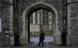 Police guard the Henry VIII gate at Windsor Castle at Windsor, England on Christmas Day, on December 25, 2021. (AP Photo/Alastair Grant)