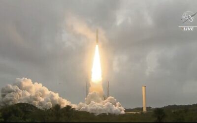 In this image released by NASA, Arianespace's Ariane 5 rocket with NASA's James Webb Space Telescope onboard, lifts off on December 25, 2021, at Europe's Spaceport, the Guiana Space Center in Kourou, French Guiana (NASA via AP)