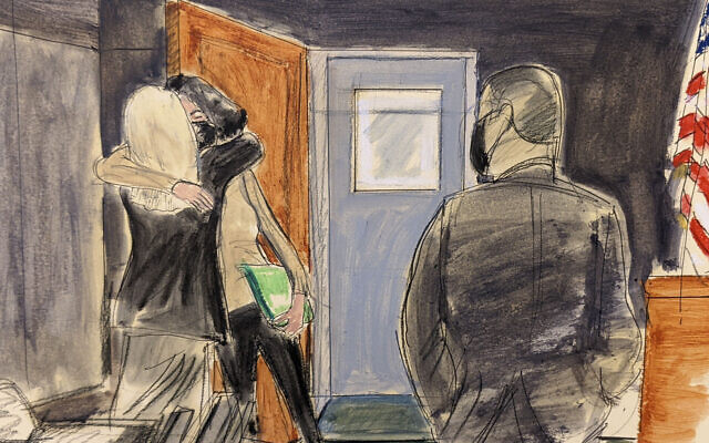 In this courtroom sketch, Ghislaine Maxwell, center, hugs her defense attorney, Laura Menninger, immediately after walking out of lock-up after a four-day break, during Maxwell's sex trafficking trial, December 27, 2021, in New York. (AP Photo/Elizabeth Williams) In this courtroom sketch, Ghislaine Maxwell, center, hugs her defense attorney, Laura Menninger, immediately after walking out of lock-up after a four-day break, during Maxwell's sex trafficking trial, December 27, 2021, in New York. (AP Photo/Elizabeth Williams)