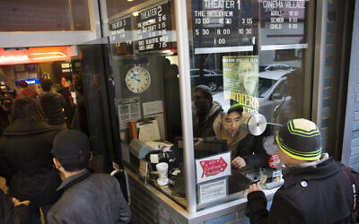 Illustrative: Patrons buy tickets at the Cinema Village movie theater box office, December 25, 2014, in New York. (AP Photo/John Minchillo)