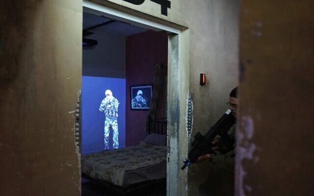 A soldier practices entering a room in a training facility located in the Nahal Brigade base in southern Israel, December 15, 2021. (Emanuel Fabian/The Times of Israel) A soldier practices entering a room in a training facility located in the Nahal Brigade base in southern Israel, December 15, 2021. (Emanuel Fabian/The Times of Israel)