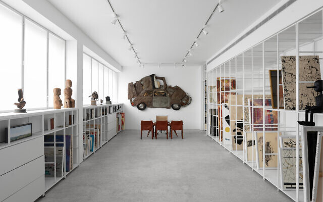 Tel Aviv's historic Gordon Gallery opened its new location in Jerusalem's Givat Shaul industrial zone on December 22, 2021, with a Ron Arad 'crushed car' sculpture on the wall (Courtesy PR)