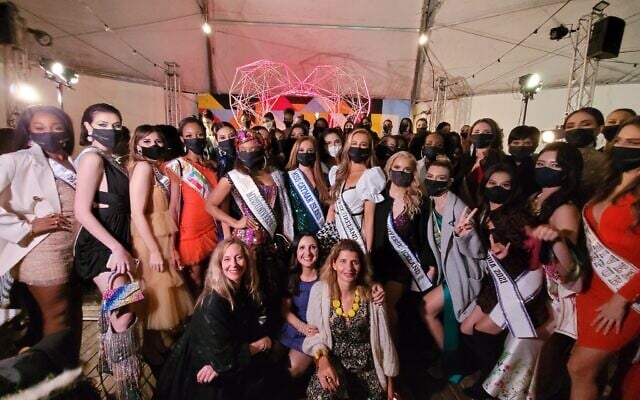 Miss Universe contestants in Israel on December 1, 2021, with stylist Stephanie Strauch (bottom left), Jerusalem deputy mayor Fleur Hasson-Nahoum (bottom middle) and Ilanit Melchior, director of Jerusalem tourism (bottom right) (Courtesy Moran Shmouelof) Miss Universe contestants in Israel on December 1, 2021, with stylist Stephanie Strauch (bottom left), Jerusalem deputy mayor Fleur Hasson-Nahoum (bottom middle) and Ilanit Melchior, director of Jerusalem tourism (bottom right) (Courtesy Moran Shmouelof)