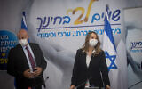 Education Minister Yifat Shasha-Biton (right) and the ministry's director, Yigal Slovik, at a press conference in Tel Aviv, August 31, 2021. (Miriam Alster/Flash90)