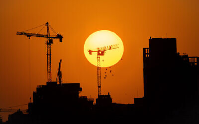 Cranes on a construction site in Jerusalem, September 1, 2021. (Nati Shohat/ Flash90/ File)