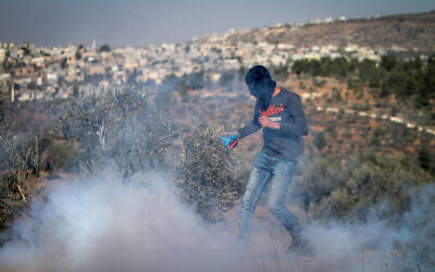 Palestinians clash with Israeli security forces during a protest in the village of Beita, near the West Bank city of Nablus, on November 12, 2021. (Nasser Ishtayeh/Flash90) Palestinians clash with Israeli security forces during a protest in the village of Beita, near the West Bank city of Nablus, on November 12, 2021. (Nasser Ishtayeh/Flash90)