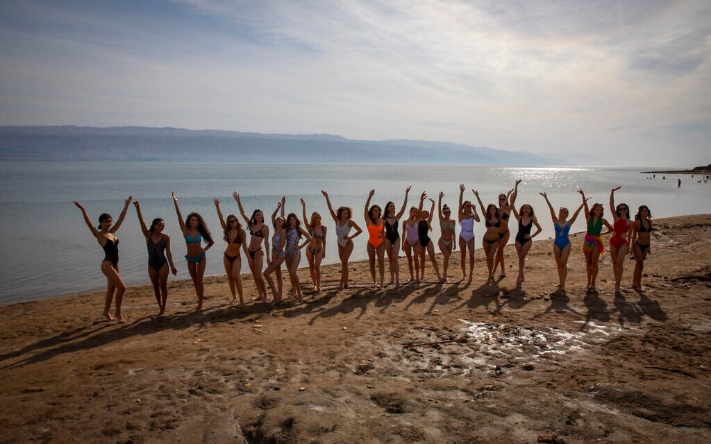 Contestants of the 2021 Miss Universe pageant enjoy a sunny day on a beach at the Dead Sea on December 1, 2021. (Olivier Fitoussi/Flash90) Contestants of the 2021 Miss Universe pageant enjoy a sunny day on a beach at the Dead Sea on December 1, 2021. (Olivier Fitoussi/Flash90)