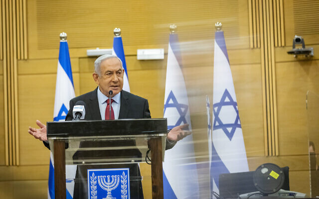 Head of opposition and head of the Likud party Benjamin Netanyahu leads a faction meeting at the Knesset, on December 6, 2021. (Olivier Fitoussi/Flash90) Head of opposition and head of the Likud party Benjamin Netanyahu leads a faction meeting at the Knesset, on December 6, 2021. (Olivier Fitoussi/Flash90)