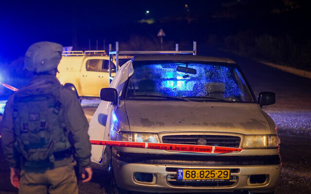 Israeli security forces inspect the scene of a shooting attack near Homesh, in the West Bank, on December 16, 2021. (Hillel Maeir/Flash90) Israeli security forces inspect the scene of a shooting attack near Homesh, in the West Bank, on December 16, 2021. (Hillel Maeir/Flash90)