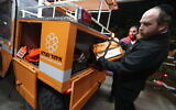 United Hatzalah volunteers check their rescue gear in the northern city of Safed on December 19, 2021, as emergency crews were on high alert ahead of winter storm 'Carmel.' (David Cohen/ Flash90)