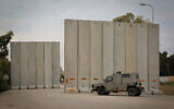 Israeli soldiers near the site of where a civilian was injured by gunfire from the Gaza Strip, in southern Israel, December 29, 2021 (Flash90)