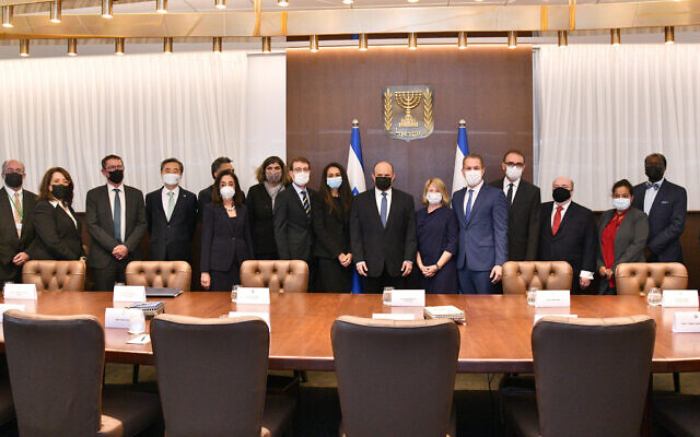 Prime Minister Naftali Bennett (C) meets with a delegation of ambassadors to the UN visiting Israel, December 21, 2021.
(Haim Zach / GPO) Prime Minister Naftali Bennett (C) meets with a delegation of ambassadors to the UN visiting Israel, December 21, 2021.
(Haim Zach / GPO)