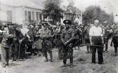 Romanian gendarmes and local collaborators deport Jews from Bricevas in 1941, with rabbi Dov Beri Yechiel at the head (public domain)