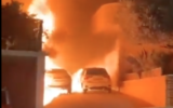 Screen capture from video of the mayor of Tirat Carmel's car on fire outside his home, December 12, 2021. (Twitter)