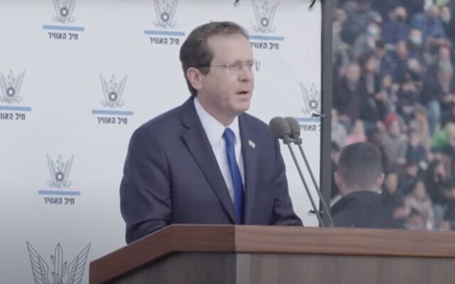 President Isaac Herzog speaks during a ceremony for graduates of the Israeli Air Force's pilot course, at the Hatzerim airbase in southern Israel, on December 22, 2021. (Screen capture: YouTube) President Isaac Herzog speaks during a ceremony for graduates of the Israeli Air Force's pilot course, at the Hatzerim airbase in southern Israel, on December 22, 2021. (Screen capture: YouTube)