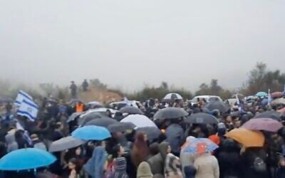 Israelis demonstrate at Homesh in the northern West Bank, on December 23, 2021, calling on the government not to demolish the outpost after a yeshiva student there was killed in a shooting attack. (Screenshot/Twitter) Israelis demonstrate at Homesh in the northern West Bank, on December 23, 2021, calling on the government not to demolish the outpost after a yeshiva student there was killed in a shooting attack. (Screenshot/Twitter)