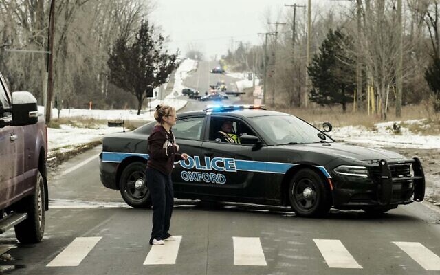 A police road block restricts access to Oxford High School following a shooting in Oxford, Michigan, November 30, 2021. (Matthew Hatcher/Getty Images/AFP) A police road block restricts access to Oxford High School following a shooting in Oxford, Michigan, November 30, 2021. (Matthew Hatcher/Getty Images/AFP)