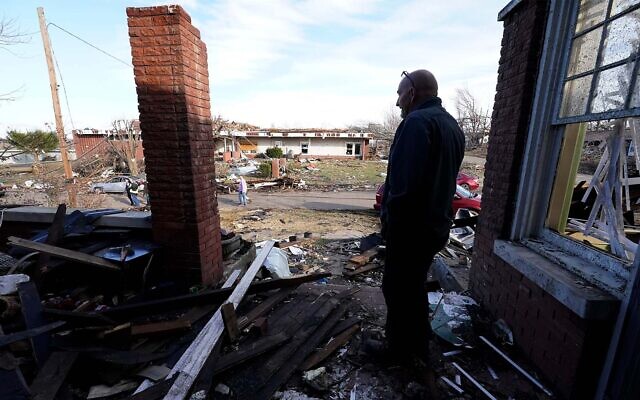 A stands near his tornado-damaged home in Mayfield, Kentucky, on December 11, 2021. (AP Photo/Mark Humphrey) A stands near his tornado-damaged home in Mayfield, Kentucky, on December 11, 2021. (AP Photo/Mark Humphrey)