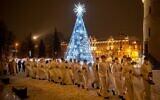 Priests and clergy walk in a procession to attend the Christmas celebration midnight Mass at the Cathedral-Basilical in Vilnius, Lithuania, December 24, 2021. (AP Photo/Mindaugas Kulbis)