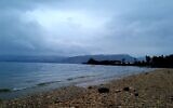Illustrative: View of the Hukok Beach, Sea of Galilee in northern Israel, as rain begins to fall, on December 18, 2021. (Tzachi Gavish/Kinneret Cities Association)