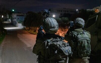 Israeli special forces conduct a raid in the village of Silat al-Harithiya, near Jenin to arrest the men suspected of having carried out a deadly shooting attack outside the Horesh outpost in the West Bank earlier in the week, on December 19, 2021. (Israel Defense Forces) Israeli special forces conduct a raid in the village of Silat al-Harithiya, near Jenin to arrest the men suspected of having carried out a deadly shooting attack outside the Horesh outpost in the West Bank earlier in the week, on December 19, 2021. (Israel Defense Forces)