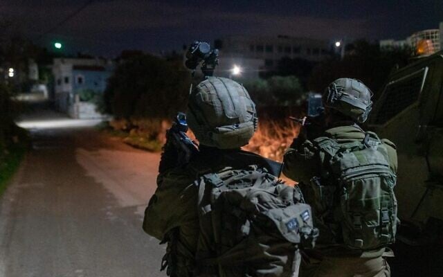 Israeli special forces conduct a raid in the village of Silat al-Harithiya, near Jenin to arrest the men suspected of having carried out a deadly shooting attack outside the Horesh outpost in the West Bank earlier in the week, on December 19, 2021. (Israel Defense Forces) Israeli special forces conduct a raid in the village of Silat al-Harithiya, near Jenin to arrest the men suspected of having carried out a deadly shooting attack outside the Horesh outpost in the West Bank earlier in the week, on December 19, 2021. (Israel Defense Forces)
