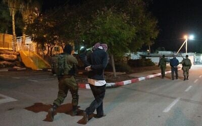 Israeli special forces arrest two men suspected of being part of the cell that carried out a deadly shooting attack outside the Horesh outpost in the West Bank, on December 19, 2021. (Israel Defense Forces) Israeli special forces arrest two men suspected of being part of the cell that carried out a deadly shooting attack outside the Horesh outpost in the West Bank, on December 19, 2021. (Israel Defense Forces)