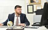 Chaim Walder works in his office in Bnei Brak in 2011. (Wikipedia CC BY-SA 3.0)