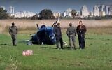 Flipped-over helicopter near Yakum on December 19, 2021 (Screen grab/Ynet)