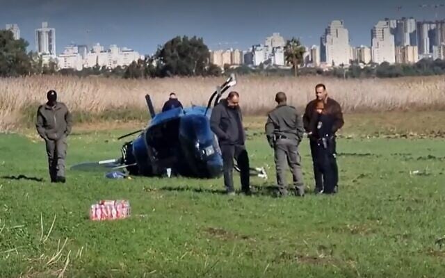Flipped-over helicopter near Yakum on December 19, 2021 (Screen grab/Ynet)