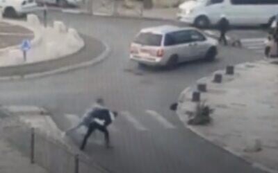 A Palestinian stabs a Haredi man in Jerusalem before being shot dead by police on December 4, 2021 (video screenshot) A Palestinian stabs a Haredi man in Jerusalem before being shot dead by police on December 4, 2021 (video screenshot)