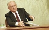 Mikhail Gorbachev, eighth and final leader of the Soviet Union, closes his resignation speech on the table after delivering it on Soviet television in the Kremlin, Moscow, Wednesday, December 25, 1991. (AP Photo/Liu Heung Shing, File)