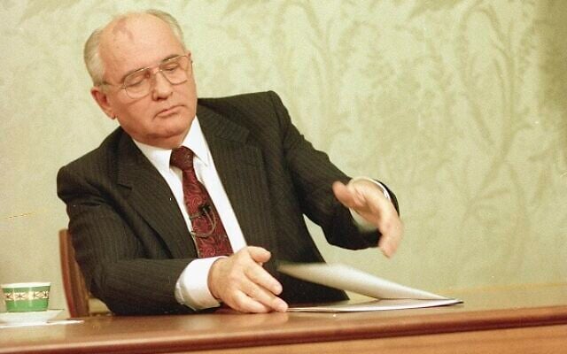 Mikhail Gorbachev, eighth and final leader of the Soviet Union, closes his resignation speech on the table after delivering it on Soviet television in the Kremlin, Moscow, Wednesday, December 25, 1991. (AP Photo/Liu Heung Shing, File)