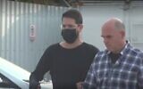 Moshe Hogeg (L)  is released to house arrest, December 14, 2021. (Screen grab/Ynet)