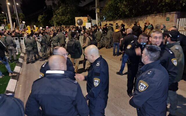 Police officers secure an anti-vaccination protest in Ra'anana, on December 18, 2021. (Israel Police) Police officers secure an anti-vaccination protest in Ra'anana, on December 18, 2021. (Israel Police)