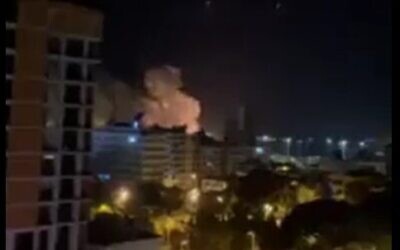 Smoke rises from an alleged Israeli missile strike on the Syrian port of Latakia on December 7, 2021 (Screencapture/Twitter)