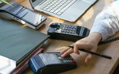 An illustrative photo of payment processing. (Mikhail Nilov from Pexels)