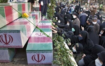 Iranians mourn in Tehran during a funeral procession for 150 Iranian soldiers killed in the Iran-Iraq war (1980-1988), whose bodies were recovered from battlefields, on January 6, 2022. (AFP)