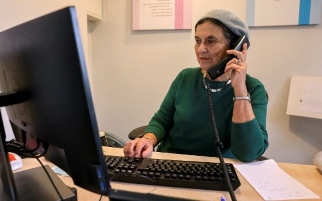 A hotline responder works at the Tahel, Crisis Center for Religious Women and Children, in Jerusalem on January 5, 2022. - "Lo Tishtok" - Hebrew for "You shall not be silent" - is a phrase gaining momentum among ultra-Orthodox Jews, or Haredim, who are being forced to reckon with claims of serious crimes, including sexual abuse of children, against several of their cultural icons. (Photo by AHMAD GHARABLI / AFP) A hotline responder works at the Tahel, Crisis Center for Religious Women and Children, in Jerusalem on January 5, 2022. - "Lo Tishtok" - Hebrew for "You shall not be silent" - is a phrase gaining momentum among ultra-Orthodox Jews, or Haredim, who are being forced to reckon with claims of serious crimes, including sexual abuse of children, against several of their cultural icons. (Photo by AHMAD GHARABLI / AFP)