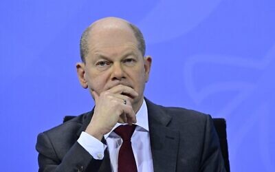 German Chancellor Olaf Scholz addresses a press conference at the Chancellery in Berlin on January 7, 2022. (John MacDougall/Pool/AFP)