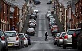 Rows of terraced houses are pictured on a residential street in Blackburn, northwest England, on January 17, 2022. (Paul Ellis/AFP)