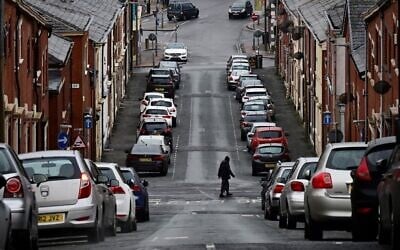 Rows of terraced houses are pictured on a residential street in Blackburn, northwest England, on January 17, 2022. (Paul Ellis/AFP)