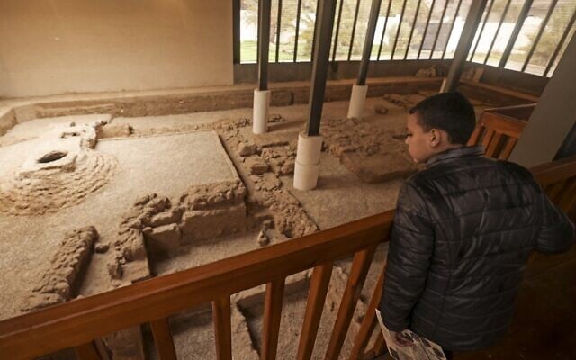A boy looks at the remnants of a Byzantine church during the inauguration of Mukheitim archaeological site in Jabalia in the northern Gaza Strip on January 24, 2022. (Mahmud HAMS / AFP) A boy looks at the remnants of a Byzantine church during the inauguration of Mukheitim archaeological site in Jabalia in the northern Gaza Strip on January 24, 2022. (Mahmud HAMS / AFP)