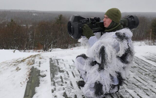 A Ukrainian serviceman aims an NLAW missile launcher during a drill at the firing ground of the International Center for Peacekeeping and Security, near the western Ukrainian city of Lviv, on January 28, 2022. (AFP)