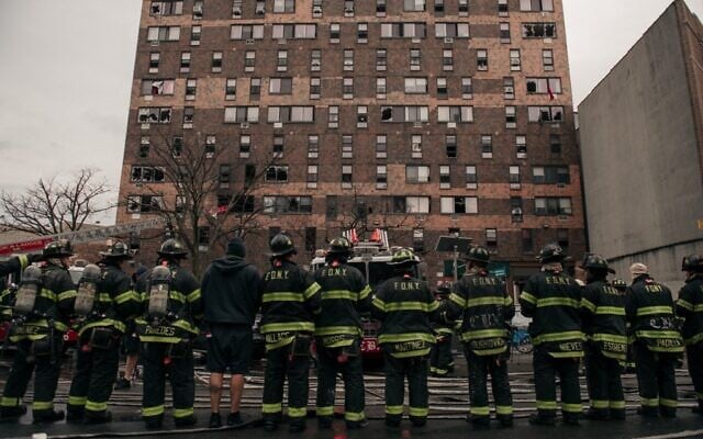 Emergency first responders remain at the scene after an intense fire at a 19-story residential building that erupted in the morning of January 9, 2022 in the Bronx borough of New York City. (Scott Heins/ Getty Images/ AFP) Emergency first responders remain at the scene after an intense fire at a 19-story residential building that erupted in the morning of January 9, 2022 in the Bronx borough of New York City. (Scott Heins/ Getty Images/ AFP)