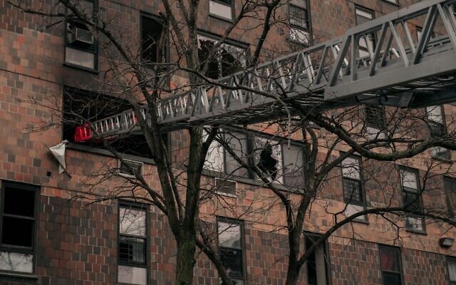 Broken windows and charred bricks mark the exterior of a 19-story residential building after a fire erupted in the morning of January 9, 2022 in the Bronx borough of New York City. (Scott Heins/Getty Images/AFP) Broken windows and charred bricks mark the exterior of a 19-story residential building after a fire erupted in the morning of January 9, 2022 in the Bronx borough of New York City. (Scott Heins/Getty Images/AFP)